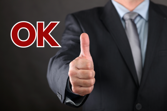 A man in a suite with his thumb up, ok, career scout japan
